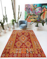 Vintage kilim rug in room decor setting, old rug, antique rug, pastel colors, faded colors, Turkish rug, vintage rug, soft rug, Portland, Oregon, rug store, rug shop, local shop, antique kilim rug, bold colors, bright colors