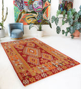 Vintage kilim rug in room decor setting, old rug, antique rug, pastel colors, faded colors, Turkish rug, vintage rug, soft rug, Portland, Oregon, rug store, rug shop, local shop, antique kilim rug, bold colors, bright colors