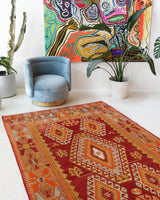Vintage kilim rug in room decor setting, old rug, antique rug, pastel colors, faded colors, Turkish rug, vintage rug, soft rug, Portland, Oregon, rug store, rug shop, local shop, antique kilim rug, bold colors, bright colors