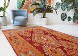 Vintage kilim rug in room decor setting, old rug, antique rug, pastel colors, faded colors, Turkish rug, vintage rug, soft rug, Portland, Oregon, rug store, rug shop, local shop, antique kilim rug, bold colors, bright colors