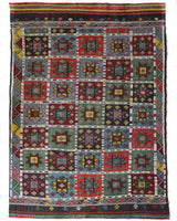 Vintage kilim rug in living room setting, bright colors, wild shaman, soft rug, bold color, Portland, Oregon, rug store, rug shop, local shop, vintage rug, modern kilim, warm colors, antique kilim rug