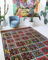 Vintage kilim rug in living room setting, bright colors, wild shaman, soft rug, bold color, Portland, Oregon, rug store, rug shop, local shop, vintage rug, modern kilim, warm colors, antique kilim rug