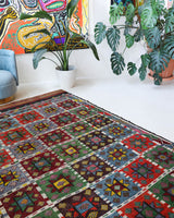 Vintage kilim rug in living room setting, bright colors, wild shaman, soft rug, bold color, Portland, Oregon, rug store, rug shop, local shop, vintage rug, modern kilim, warm colors, antique kilim rug