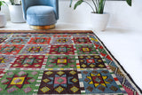 Vintage kilim rug in living room setting, bright colors, wild shaman, soft rug, bold color, Portland, Oregon, rug store, rug shop, local shop, vintage rug, modern kilim, warm colors, antique kilim rug