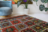 Vintage kilim rug in living room setting, bright colors, wild shaman, soft rug, bold color, Portland, Oregon, rug store, rug shop, local shop, vintage rug, modern kilim, warm colors, antique kilim rug