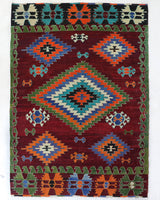 Vintage kilim rug in room decor setting, old rug, antique rug, pastel colors, faded colors, Turkish rug, vintage rug, soft rug, Portland, Oregon, rug store, rug shop, local shop, antique kilim rug, bold colors, bright colors, faded colors