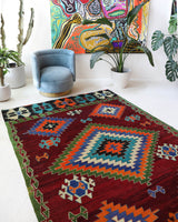 Vintage kilim rug in room decor setting, old rug, antique rug, pastel colors, faded colors, Turkish rug, vintage rug, soft rug, Portland, Oregon, rug store, rug shop, local shop, antique kilim rug, bold colors, bright colors, faded colors