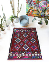 Vintage kilim rug in room decor setting, old rug, antique rug, pastel colors, faded colors, Turkish rug, vintage rug, soft rug, Portland, Oregon, rug store, rug shop, local shop, antique kilim rug, bold colors, bright colors, faded colors