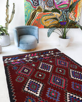 Vintage kilim rug in room decor setting, old rug, antique rug, pastel colors, faded colors, Turkish rug, vintage rug, soft rug, Portland, Oregon, rug store, rug shop, local shop, antique kilim rug, bold colors, bright colors, faded colors