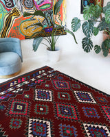 Vintage kilim rug in room decor setting, old rug, antique rug, pastel colors, faded colors, Turkish rug, vintage rug, soft rug, Portland, Oregon, rug store, rug shop, local shop, antique kilim rug, bold colors, bright colors, faded colors