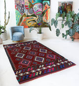 Vintage kilim rug in room decor setting, old rug, antique rug, pastel colors, faded colors, Turkish rug, vintage rug, soft rug, Portland, Oregon, rug store, rug shop, local shop, antique kilim rug, bold colors, bright colors, faded colors