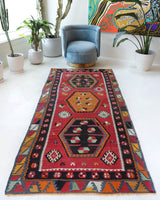 Vintage Turkish runner rug in a living room setting, pile rug, Turkish rug, vintage rug, portland, rug shop, bright colors, wild shaman, soft rug, bold color, Portland, Oregon, rug store, rug shop, local shop