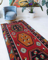 Vintage Turkish runner rug in a living room setting, pile rug, Turkish rug, vintage rug, portland, rug shop, bright colors, wild shaman, soft rug, bold color, Portland, Oregon, rug store, rug shop, local shop