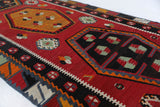 Vintage Turkish runner rug in a living room setting, pile rug, Turkish rug, vintage rug, portland, rug shop, bright colors, wild shaman, soft rug, bold color, Portland, Oregon, rug store, rug shop, local shop