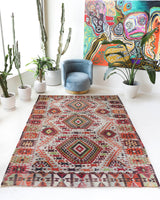 Vintage kilim rug in living room setting, old rug, antique rug, pastel colors, faded colors, Turkish rug, vintage rug, soft rug, Portland, Oregon, rug store, rug shop, local shop, earthy tones, earthy colors, warm colors