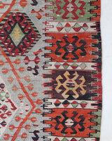 Vintage kilim rug in living room setting, old rug, antique rug, pastel colors, faded colors, Turkish rug, vintage rug, soft rug, Portland, Oregon, rug store, rug shop, local shop, earthy tones, earthy colors, warm colors