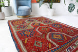 Vintage kilim rug in living room setting, bright colors, wild shaman, soft rug, bold color, Portland, Oregon, rug store, rug shop, local shop, vintage rug, modern kilim, warm colors, antique rug, antique kilim
