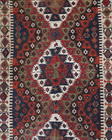 Vintage kilim rug in living room setting, bright colors, wild shaman, soft rug, bold color, Portland, Oregon, rug store, rug shop, local shop, vintage rug, modern kilim, warm colors, antique rug, antique kilim