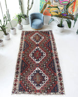 Vintage kilim rug in living room setting, bright colors, wild shaman, soft rug, bold color, Portland, Oregon, rug store, rug shop, local shop, vintage rug, modern kilim, warm colors, antique rug, antique kilim