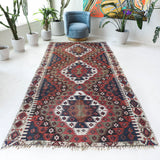 Vintage kilim rug in living room setting, bright colors, wild shaman, soft rug, bold color, Portland, Oregon, rug store, rug shop, local shop, vintage rug, modern kilim, warm colors, antique rug, antique kilim