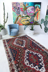 Vintage kilim rug in living room setting, bright colors, wild shaman, soft rug, bold color, Portland, Oregon, rug store, rug shop, local shop, vintage rug, modern kilim, warm colors, antique rug, antique kilim