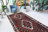 Vintage kilim rug in living room setting, bright colors, wild shaman, soft rug, bold color, Portland, Oregon, rug store, rug shop, local shop, vintage rug, modern kilim, warm colors, antique rug, antique kilim