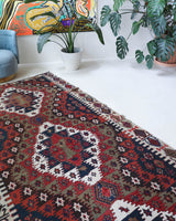 Vintage kilim rug in living room setting, bright colors, wild shaman, soft rug, bold color, Portland, Oregon, rug store, rug shop, local shop, vintage rug, modern kilim, warm colors, antique rug, antique kilim