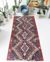 Vintage kilim rug in living room setting, old rug, antique rug, pastel colors, faded colors, Turkish rug, vintage rug, soft rug, Portland, Oregon, rug store, rug shop, local shop, earthy tones, earthy colors, warm colors