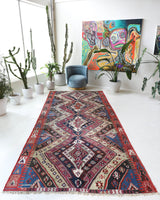 Vintage kilim rug in living room setting, old rug, antique rug, pastel colors, faded colors, Turkish rug, vintage rug, soft rug, Portland, Oregon, rug store, rug shop, local shop, earthy tones, earthy colors, warm colors