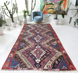 Vintage kilim rug in living room setting, old rug, antique rug, pastel colors, faded colors, Turkish rug, vintage rug, soft rug, Portland, Oregon, rug store, rug shop, local shop, earthy tones, earthy colors, warm colors