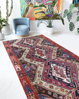 Vintage kilim rug in living room setting, old rug, antique rug, pastel colors, faded colors, Turkish rug, vintage rug, soft rug, Portland, Oregon, rug store, rug shop, local shop, earthy tones, earthy colors, warm colors