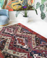 Vintage kilim rug in living room setting, old rug, antique rug, pastel colors, faded colors, Turkish rug, vintage rug, soft rug, Portland, Oregon, rug store, rug shop, local shop, earthy tones, earthy colors, warm colors