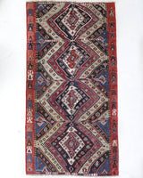 Vintage kilim rug in living room setting, old rug, antique rug, pastel colors, faded colors, Turkish rug, vintage rug, soft rug, Portland, Oregon, rug store, rug shop, local shop, earthy tones, earthy colors, warm colors