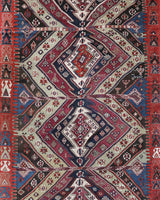 Vintage kilim rug in living room setting, old rug, antique rug, pastel colors, faded colors, Turkish rug, vintage rug, soft rug, Portland, Oregon, rug store, rug shop, local shop, earthy tones, earthy colors, warm colors