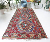 Vintage kilim rug in living room setting, bright colors, wild shaman, soft rug, bold color, Portland, Oregon, rug store, rug shop, local shop, vintage rug, modern kilim, warm colors, antique rug, antique kilim