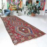 Vintage kilim rug in living room setting, bright colors, wild shaman, soft rug, bold color, Portland, Oregon, rug store, rug shop, local shop, vintage rug, modern kilim, warm colors, antique rug, antique kilim