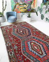 Vintage kilim rug in living room setting, bright colors, wild shaman, soft rug, bold color, Portland, Oregon, rug store, rug shop, local shop, vintage rug, modern kilim, warm colors, antique rug, antique kilim