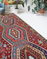 Vintage kilim rug in living room setting, bright colors, wild shaman, soft rug, bold color, Portland, Oregon, rug store, rug shop, local shop, vintage rug, modern kilim, warm colors, antique rug, antique kilim