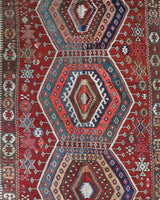 Vintage kilim rug in living room setting, bright colors, wild shaman, soft rug, bold color, Portland, Oregon, rug store, rug shop, local shop, vintage rug, modern kilim, warm colors, antique rug, antique kilim