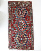 Vintage kilim rug in living room setting, bright colors, wild shaman, soft rug, bold color, Portland, Oregon, rug store, rug shop, local shop, vintage rug, modern kilim, warm colors, antique rug, antique kilim