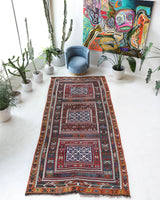 Vintage kilim rug in living room setting, bright colors, wild shaman, soft rug, bold color, Portland, Oregon, rug store, rug shop, local shop, vintage rug, modern kilim, warm colors, antique rug, antique kilim
