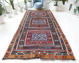 Vintage kilim rug in living room setting, bright colors, wild shaman, soft rug, bold color, Portland, Oregon, rug store, rug shop, local shop, vintage rug, modern kilim, warm colors, antique rug, antique kilim