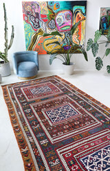 Vintage kilim rug in living room setting, bright colors, wild shaman, soft rug, bold color, Portland, Oregon, rug store, rug shop, local shop, vintage rug, modern kilim, warm colors, antique rug, antique kilim