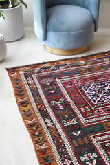 Vintage kilim rug in living room setting, bright colors, wild shaman, soft rug, bold color, Portland, Oregon, rug store, rug shop, local shop, vintage rug, modern kilim, warm colors, antique rug, antique kilim