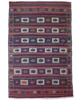 Vintage kilim rug in living room setting, old rug, antique rug, pastel colors, faded colors, Turkish rug, vintage rug, soft rug, Portland, Oregon, rug store, rug shop, local shop, earthy tones, earthy colors, warm colors