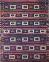 Vintage kilim rug in living room setting, old rug, antique rug, pastel colors, faded colors, Turkish rug, vintage rug, soft rug, Portland, Oregon, rug store, rug shop, local shop, earthy tones, earthy colors, warm colors