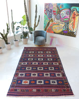 Vintage kilim rug in living room setting, old rug, antique rug, pastel colors, faded colors, Turkish rug, vintage rug, soft rug, Portland, Oregon, rug store, rug shop, local shop, earthy tones, earthy colors, warm colors