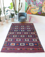 Vintage kilim rug in living room setting, old rug, antique rug, pastel colors, faded colors, Turkish rug, vintage rug, soft rug, Portland, Oregon, rug store, rug shop, local shop, earthy tones, earthy colors, warm colors