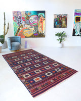 Vintage kilim rug in living room setting, old rug, antique rug, pastel colors, faded colors, Turkish rug, vintage rug, soft rug, Portland, Oregon, rug store, rug shop, local shop, earthy tones, earthy colors, warm colors