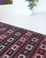 Vintage kilim rug in living room setting, old rug, antique rug, pastel colors, faded colors, Turkish rug, vintage rug, soft rug, Portland, Oregon, rug store, rug shop, local shop, earthy tones, earthy colors, warm colors